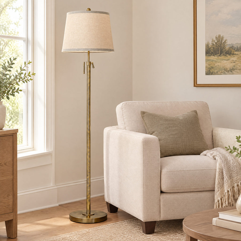 Antique bronze floor lamp beside a sofa to show its height