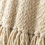 Close-up of the beige knit and tassel trim
