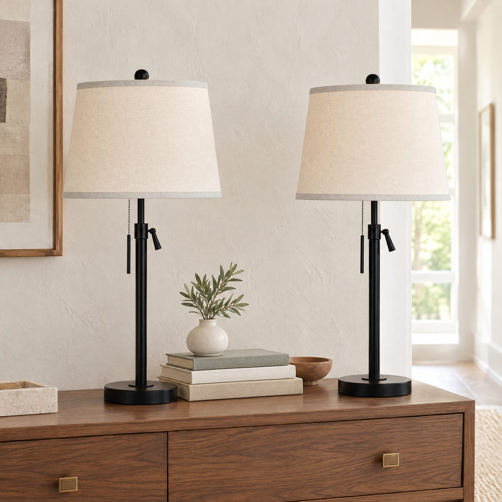 Black adjustable table lamp on a bedside table to show its height