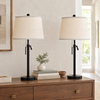 Black adjustable table lamp on a bedside table to show its height