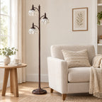 Bronze glass tree floor lamp beside a sofa to show its height