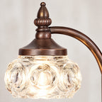 Close-up of the bronze finish and glass shade detail