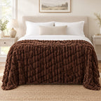 Chocolate reversible faux fur throw draped over a chair to show its size