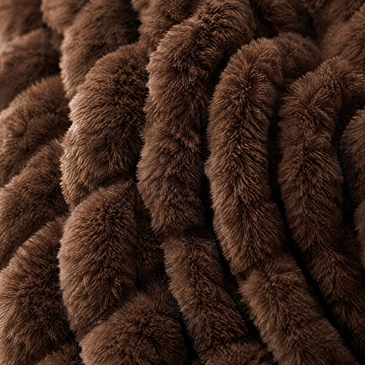 Close-up showing both sides of the chocolate reversible faux fur