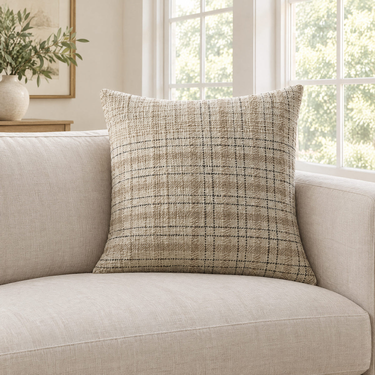 Cricket beige and black check cushion on a sofa to show its size