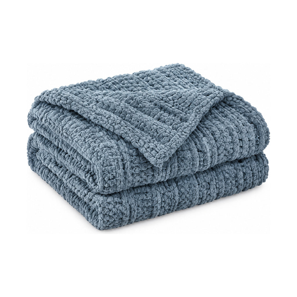 Dusty blue chunky knit throw, folded product shot on a white background