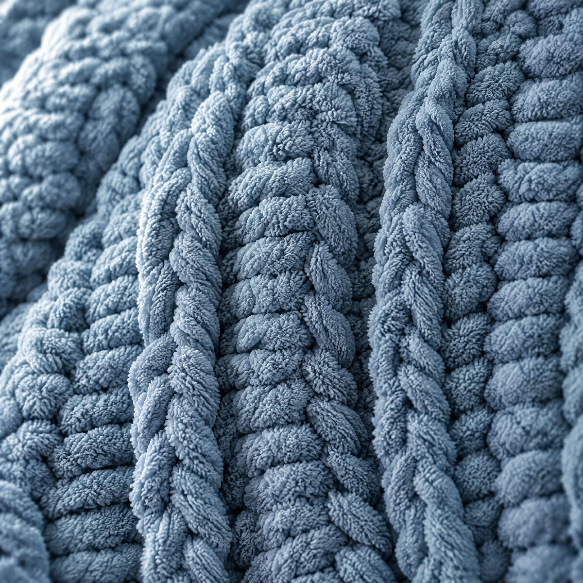 Close-up of the dusty blue chunky knit weave