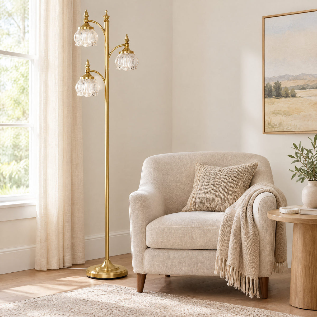 Gold glass tree floor lamp beside a sofa to show its height