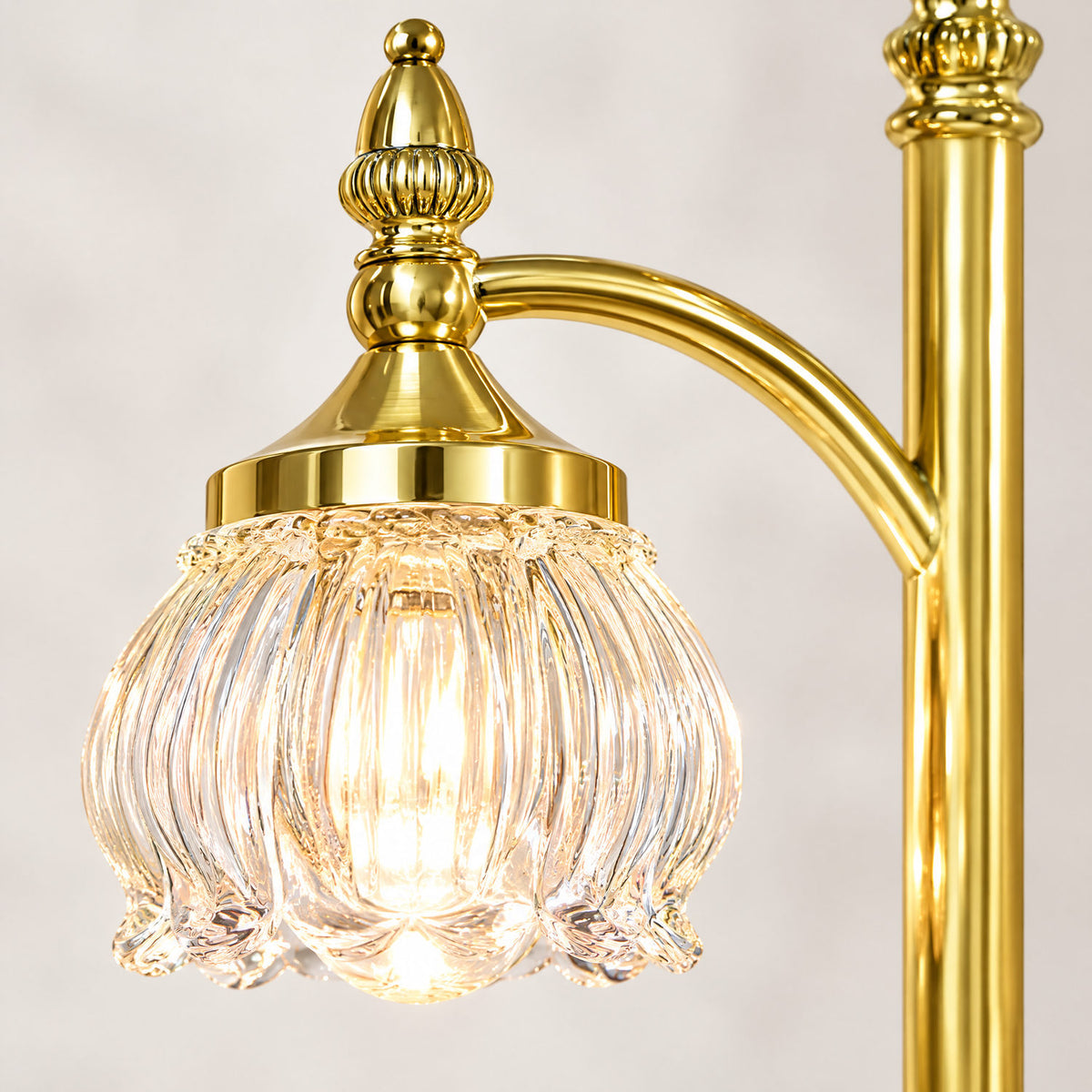 Close-up of the gold finish and glass shade detail