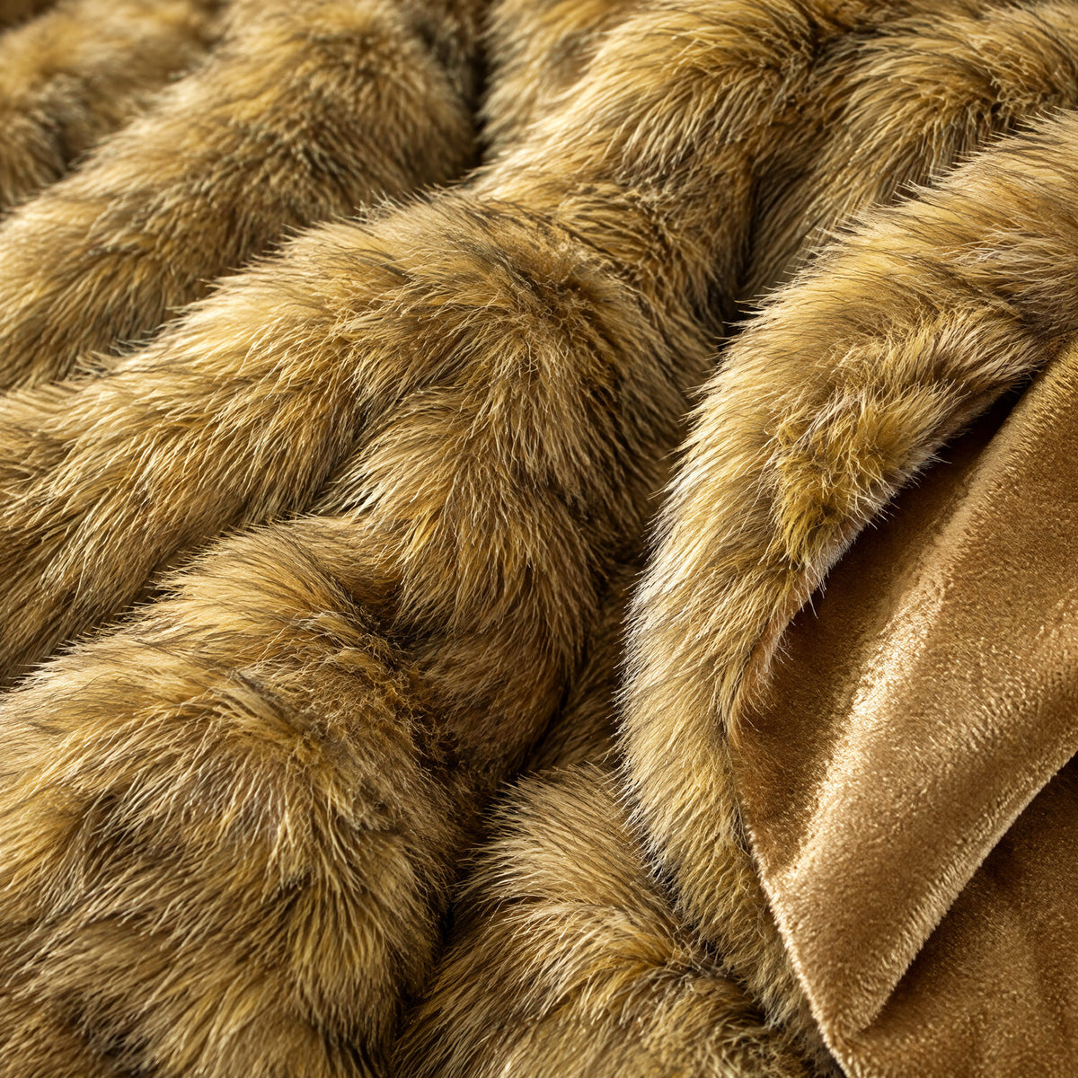 Close-up of the golden faux fur pile and velvet reverse