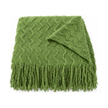 Green textured knit throw, folded product shot on a white background