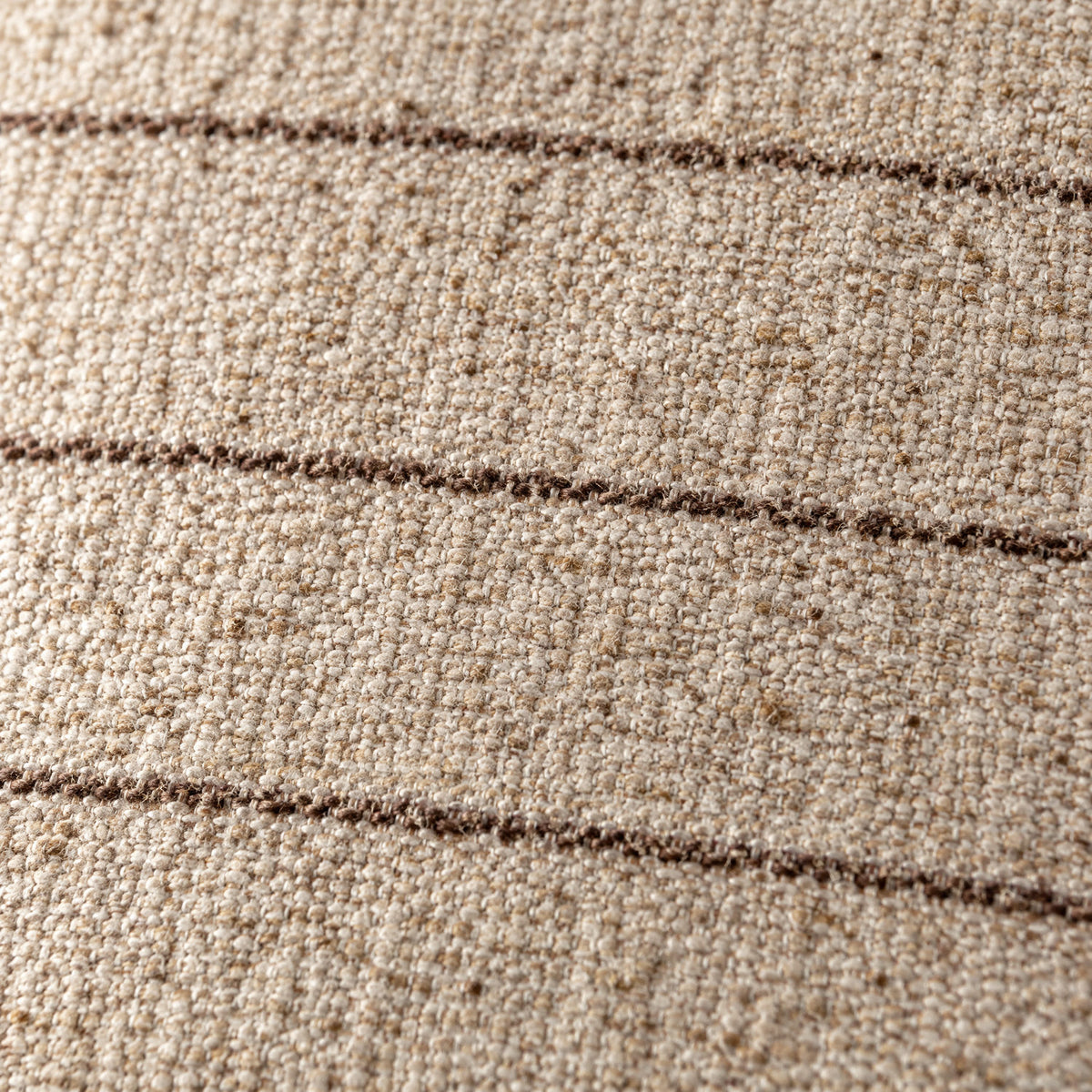Close-up of the Keisha cushion weave in natural and brown
