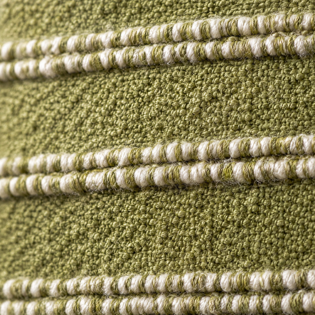 Close-up of the Landry cushion weave in green and natural