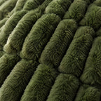 Close-up showing both sides of the olive reversible faux fur