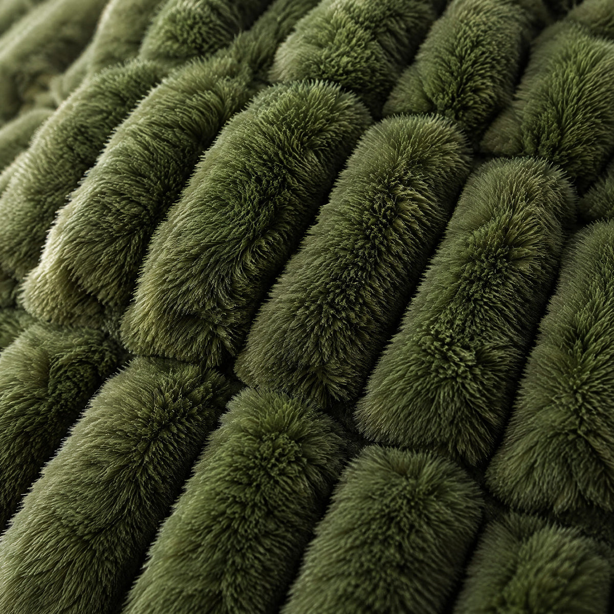 Close-up showing both sides of the olive reversible faux fur